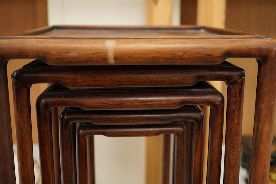 A nest of five Chinese hardwood stands, tallest (largest) 32cm high